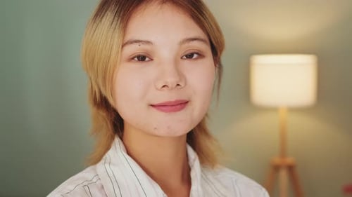 Smiling Young Woman in White Shirt