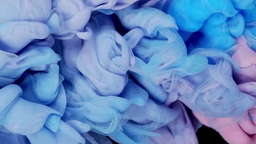 Dynamic Elegance Blue and Pink Glitter Ink Spreading in Water Creating Abstract Beauty