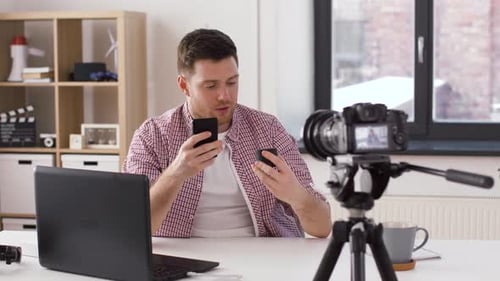 Blogging, Videoblog and People Concept - Male Blogger with Camera Recording Video