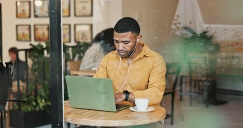 Man, laptop and freelancer in cafe for remote work, social networking and researching on internet
