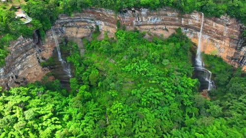 Aerial View of Tropical Rainforest and Waterfalls