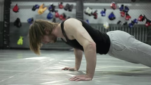 Man Doing Pushups in Gym for Fitness