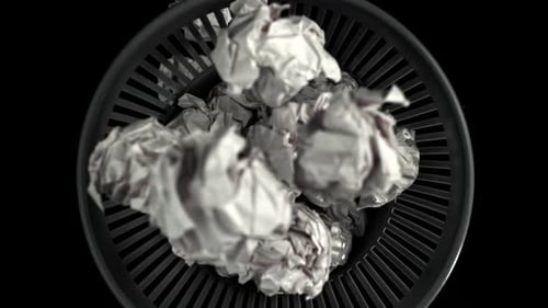 Du papier froissé tombe à la poubelle, filmé par une caméra haute vitesse à 1000 images par seconde
