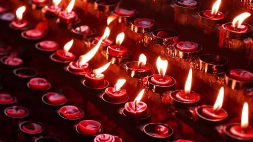 Rows of candles in a church or temple.