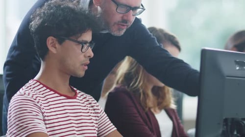 Office Workers Collaborating in Bright Workplace Environment