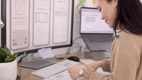 Woman, developer and wireframes with technology in design, planning or strategy at the office