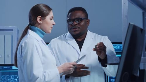 Diverse Team of Microelectronic Engineers Discuss Current Developments in a Science Lab Workplace of