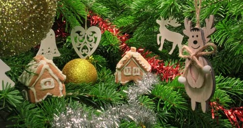 Green Christmas tree with ornaments. Christmas tree view from inside.