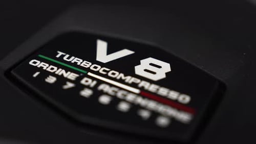 Close Up of Lamborghini Urus Interior V8 Engine Badge Details