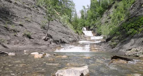 Scenic Waterfall Cascading Down Rocky Terrain. Crowsnest Pass, Alberta, Canada.