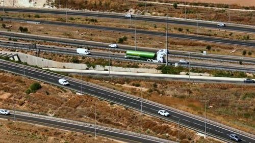 Highway traffic on multiple highways roads with traffic on all roads