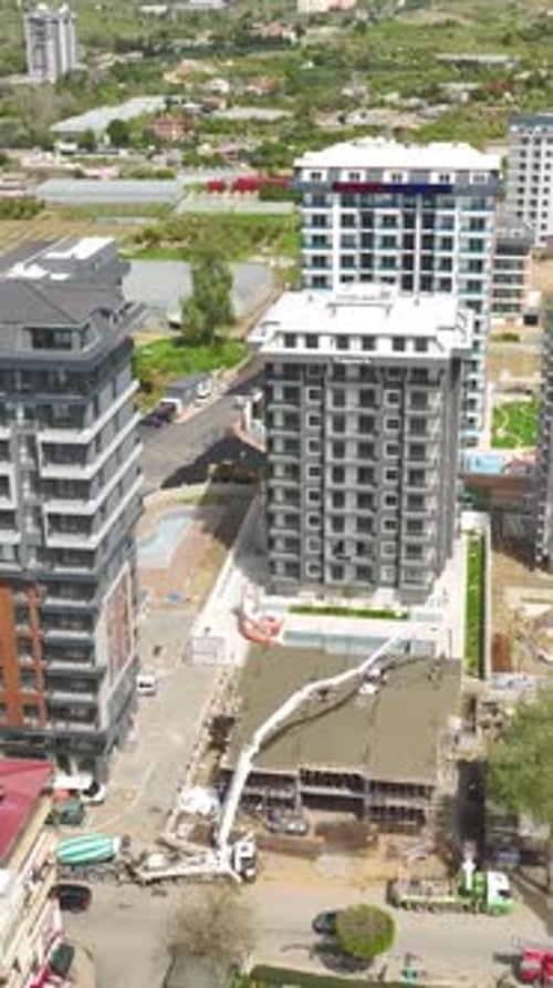 Vertical Video Builders and Engineers Raise HighRises With Heavy Machinery