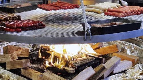 Sausages and Meat Grilling on a Wood Barbecue