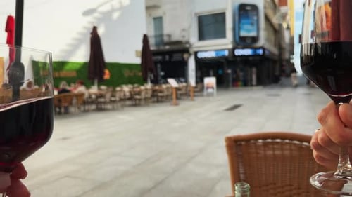 Toasting Red Wine Glasses Outside in the City