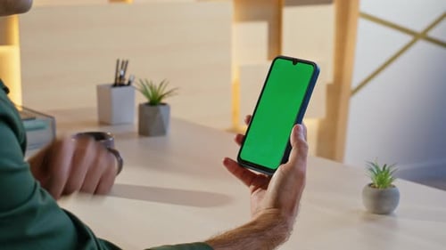 Freelancer Reading Message Mockup Mobile Phone at Contemporary Workplace Closeup