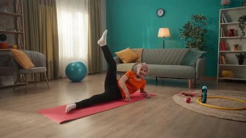 Senior Woman Exercising Leg Lifts at Home