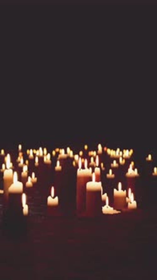 Flickering Candles Vertical Video in Dark Ambient Setting