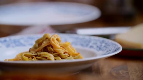 Delicious Pasta Dish Served with Sauce in Kitchen