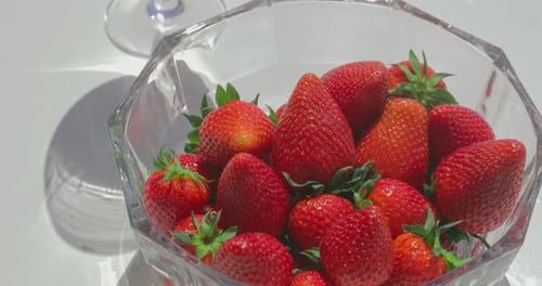 Bowl of Ripe Red Strawberries in Sunlight