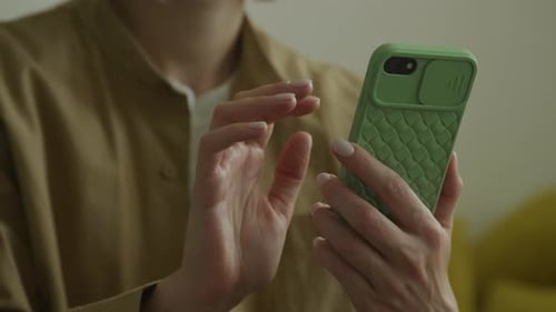 Unrecognizable Female Using Green Smartphone Close Up