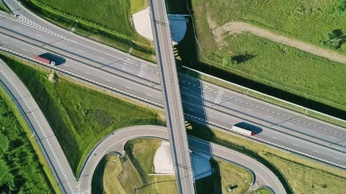 Transport Interchange on the Highway Aerial of Cars Drive Along the Highway Outside the City