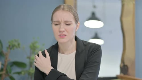 Tired Businesswoman Having Shoulder Pain