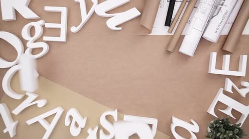 Architects desk with cardboard letters showing creativity in business
