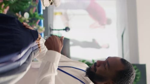 Man Shopping for Shirts in a Boutique