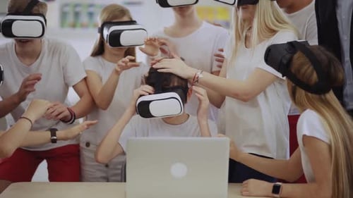 Excited Teens Experience Virtual Reality with VR Headsets