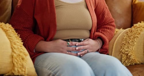 Hands, sick and woman with pain, stomach ache and digestion or gut health problem