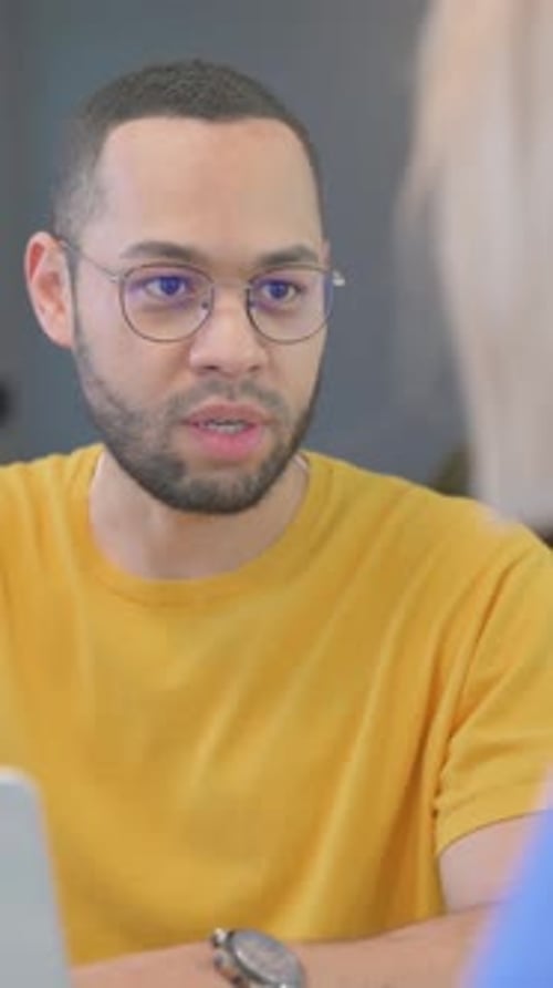 Close up of Creative People Talking at Work, vertical video