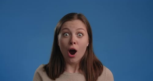 Happy Girl is Thrilled and Exited Woman's Emotions on Chroma Key Blue Screen 60p Prores