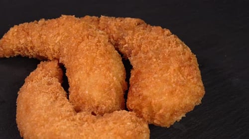 Golden-fried shrimp or breadcrumb-coated prawn appetizer spin. Video for promoting quick bites