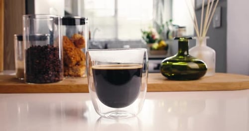 Hot Coffee in Glass Cup on Counter