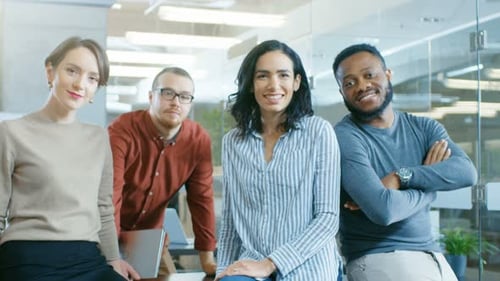 Smiling Professionals Gather in Bright Modern Office