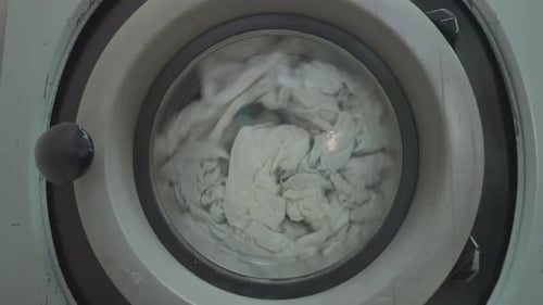 Laundry Spinning Inside a Gray Washing Machine