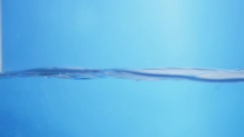 Crystal Clear Ripple Effect. Water Droplets Creating Smooth Waves in a Calm Surface.