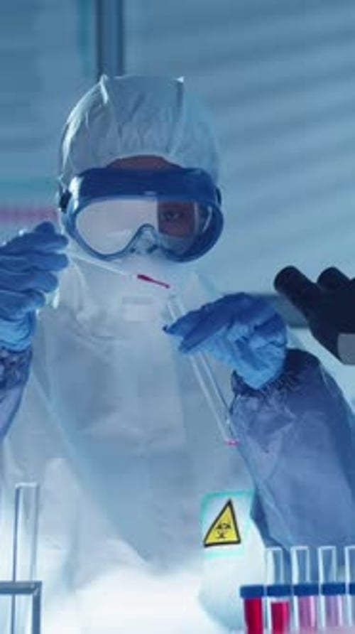 Scientist With Blood Sample Works in Laboratory