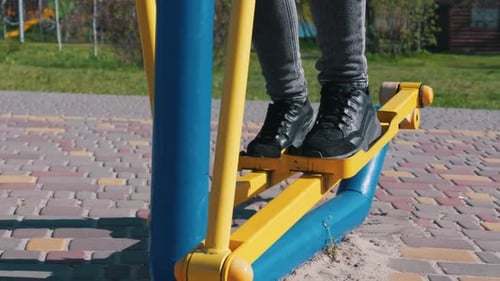 Rhythmic Leg Movement on Outdoor Stepper Machine for Fitness Action