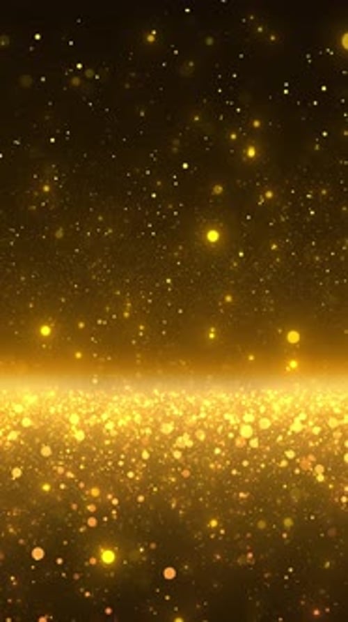 Gold dust particles fly in slow motion in the air lingering slowly. Dust Particles Background Bokeh