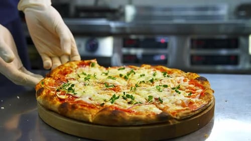 Close Up Chef Taking Pizza Slice