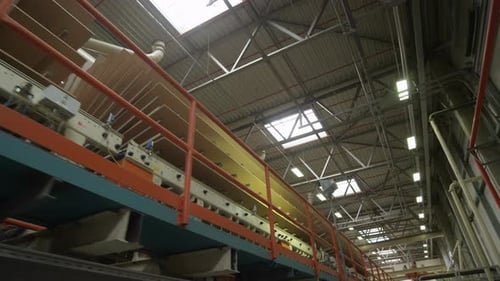 Motion Down Chipboard Conveyor in Production Workshop