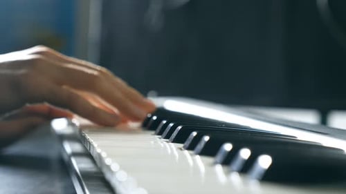 Close Up Fingers of Pianist at the Piano Keys Mens Arms Plays Solo of Music or New Melody Hands of