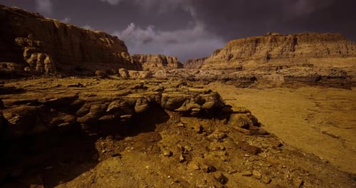 Majestic Rock Formations Under Dramatic Sky at Desert Landscape Location