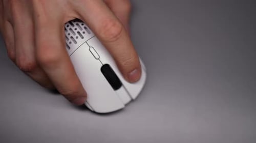 Closeup Top View Hand of Unrecognizable Male Freelancer Using Modern Wireless Mouse Working on