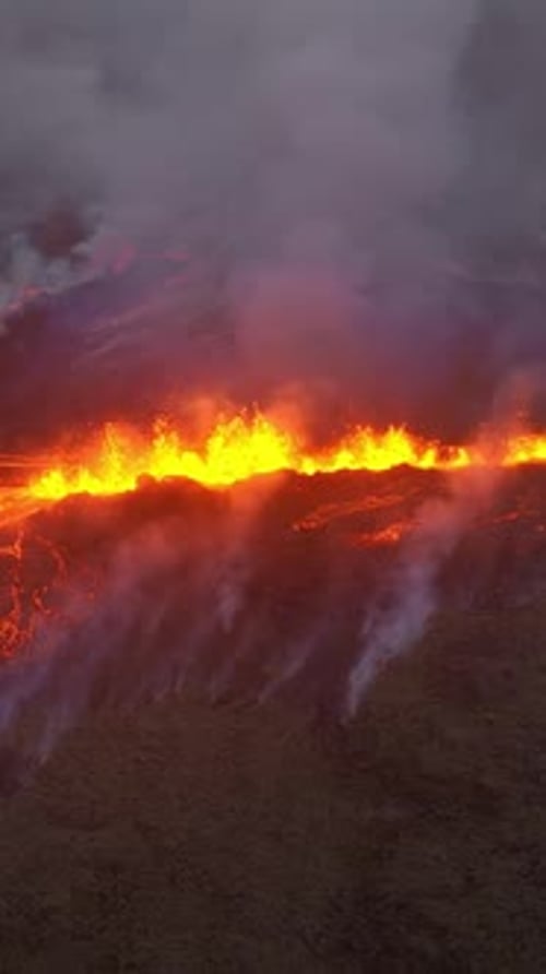 Vertical Screen Volcano Eruption in 2023 Red Burning Lava Erupts From the Ground in Iceland