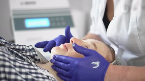 Adult Receiving a Facial Treatment Close Up