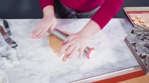 Rolling Out Cookie Dough for Christmas Cookies