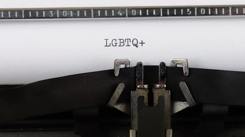 Vintage Typewriter Types LGBTQ+ Text Close Up