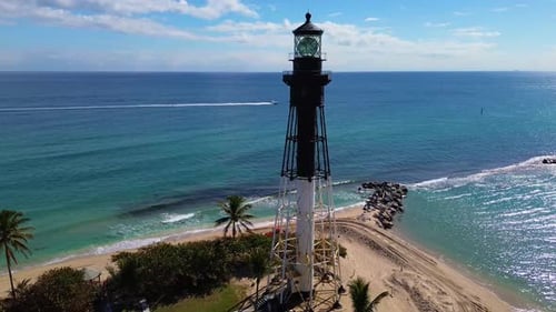 A south Florida Lighthouse standing above the beautiful tropical waters of the Atlantic Ocean.